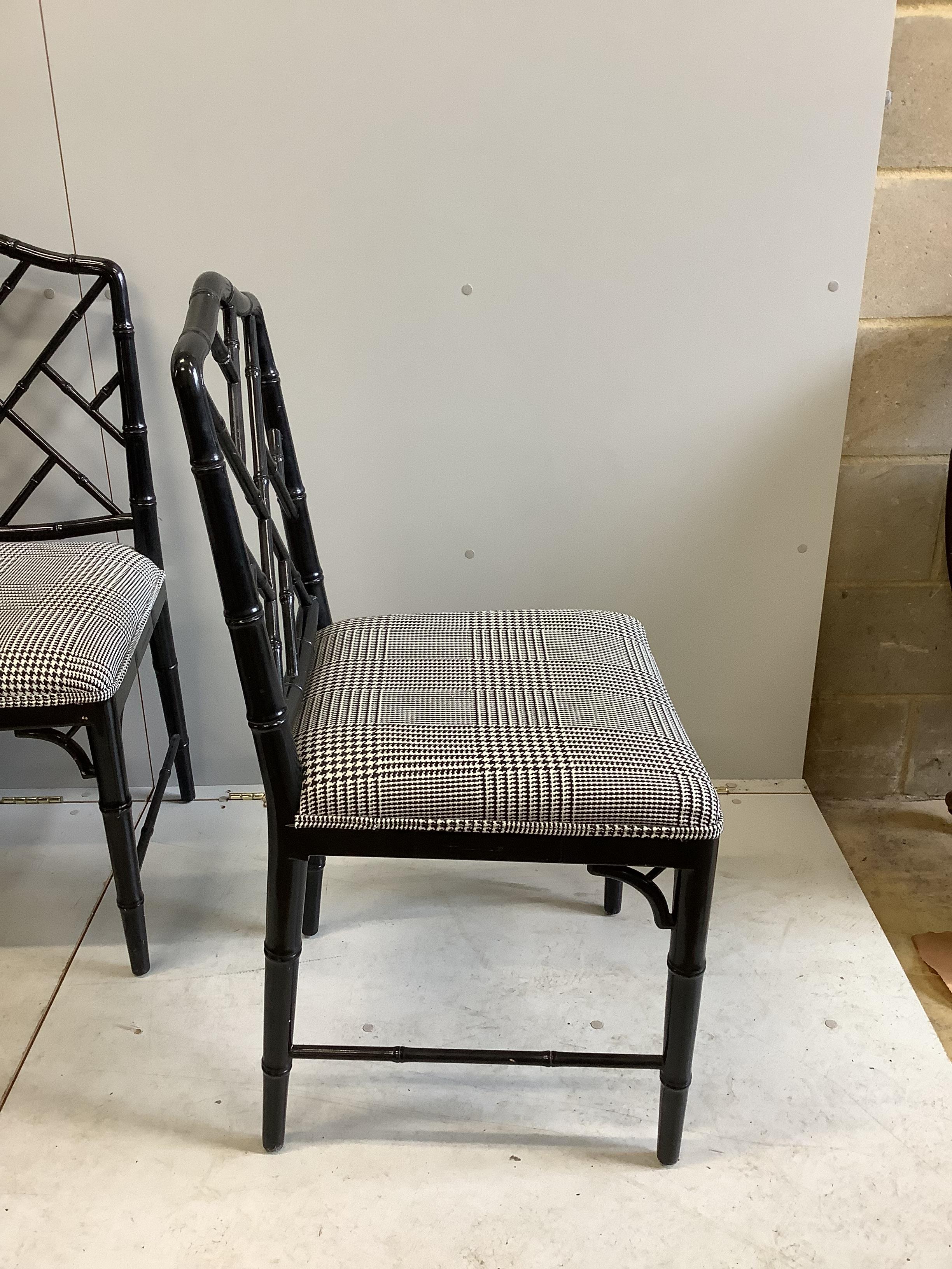 A set of eight reproduction ebonised faux bamboo dining chairs